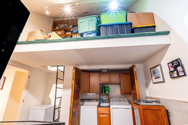 kitchen with track lighting and refrigerator