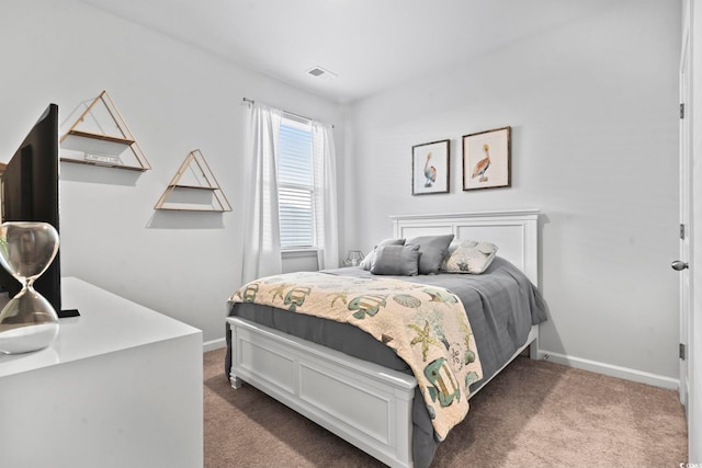 bedroom featuring dark carpet