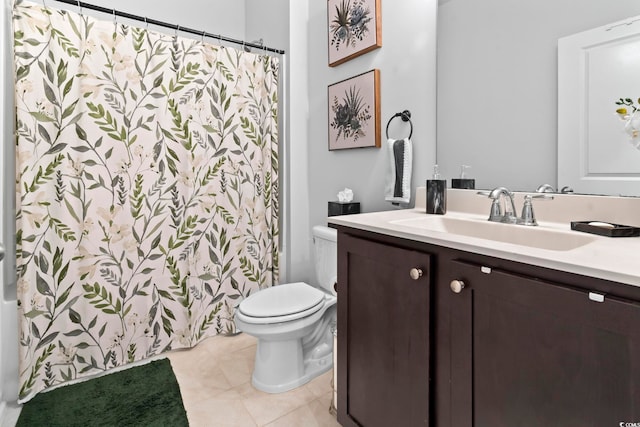 bathroom featuring tile patterned floors, toilet, and vanity