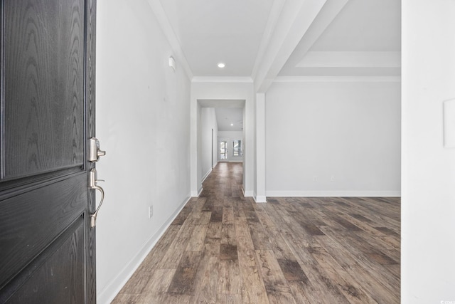 corridor featuring ornamental molding and hardwood / wood-style flooring