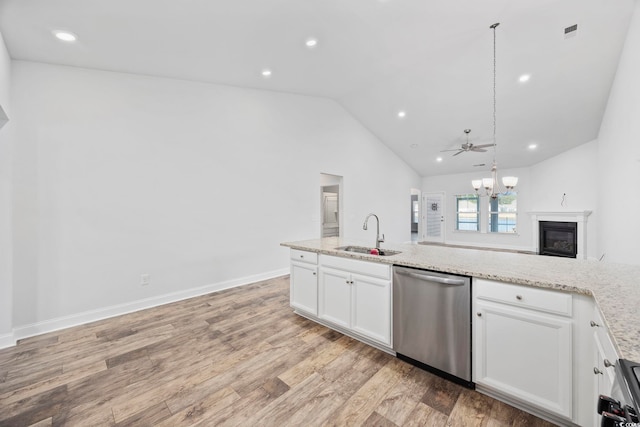 kitchen featuring light stone countertops, dishwasher, white cabinets, and sink