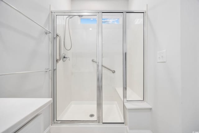 bathroom featuring an enclosed shower