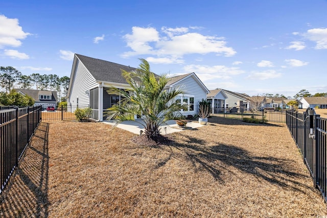 back of property featuring a yard