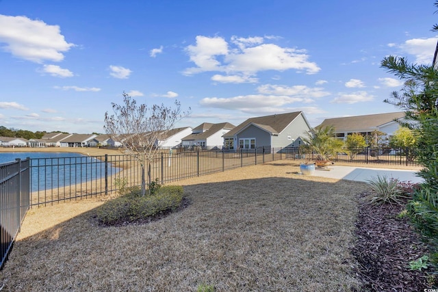 view of yard featuring a patio area and a water view