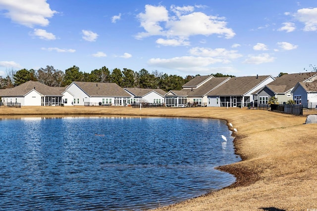 view of pool featuring a water view