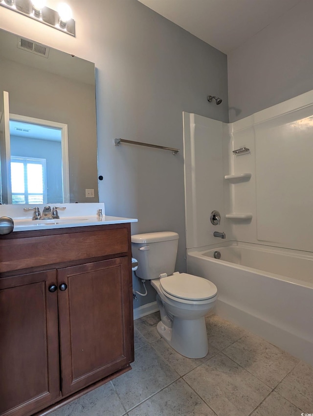 full bathroom with tile patterned floors, shower / bathing tub combination, vanity, and toilet