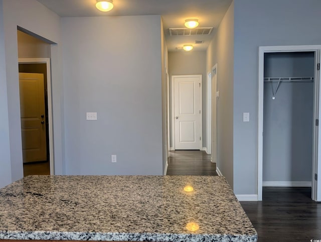 interior space with dark hardwood / wood-style floors