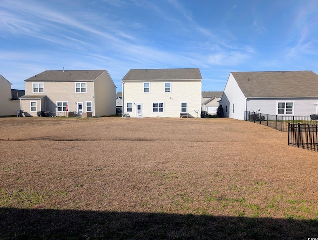 back of house with a yard