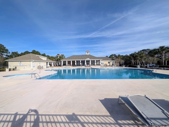 view of swimming pool with a patio