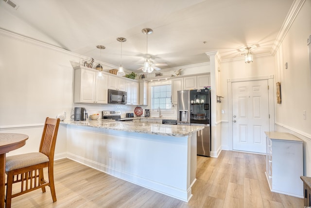 kitchen featuring light hardwood / wood-style floors, kitchen peninsula, sink, light stone countertops, and stainless steel appliances