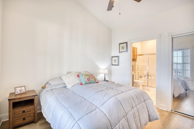 bedroom featuring ceiling fan, light hardwood / wood-style floors, connected bathroom, and lofted ceiling