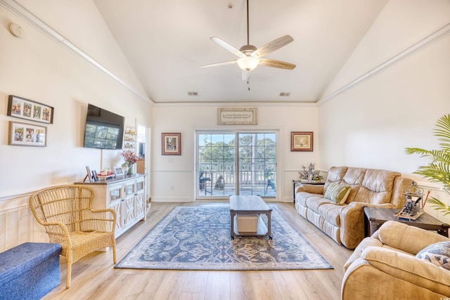 living room featuring ceiling fan, high vaulted ceiling, and light wood-type flooring