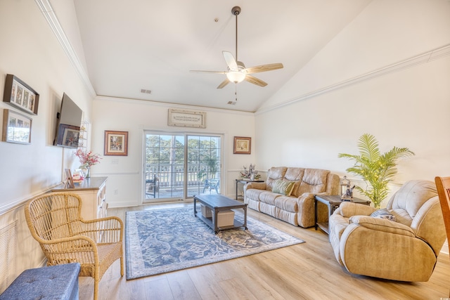 living room featuring ceiling fan, vaulted ceiling, and light hardwood / wood-style flooring