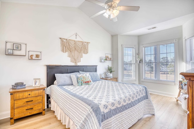 bedroom featuring ceiling fan, vaulted ceiling, and light hardwood / wood-style flooring