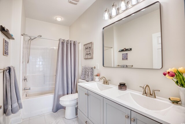 full bathroom featuring toilet, vanity, and shower / bath combo