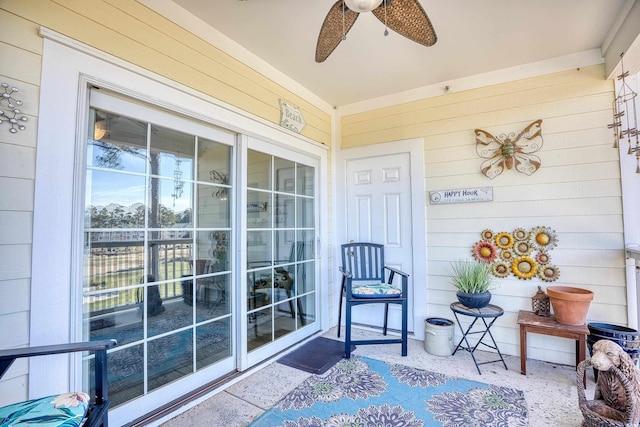 property entrance featuring ceiling fan and covered porch