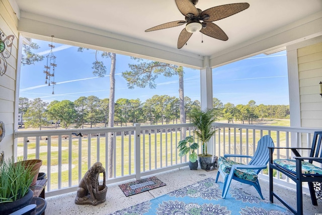 sunroom / solarium with ceiling fan and a healthy amount of sunlight