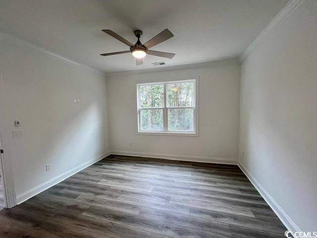 spare room featuring ceiling fan, dark hardwood / wood-style flooring, and ornamental molding