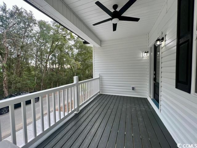 wooden terrace with ceiling fan