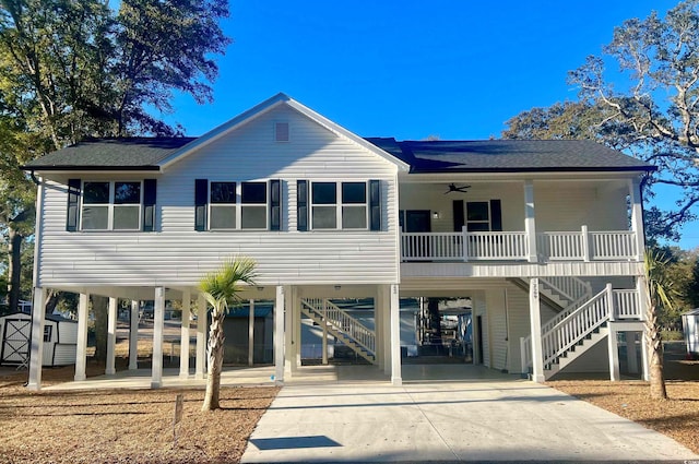 view of front facade featuring stairway, a porch, and a carport