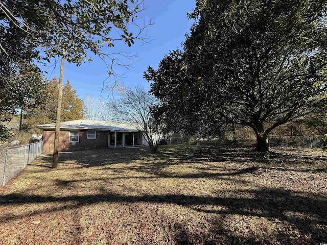 view of yard with a fenced backyard