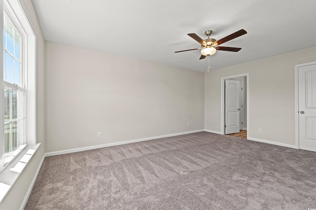 112 Lakota Loop, Longs, SC 29568 - unfurnished bedroom with carpet, baseboards, and a ceiling fan