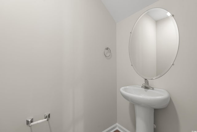 112 Lakota Loop, Longs, SC 29568 - bathroom featuring baseboards and lofted ceiling