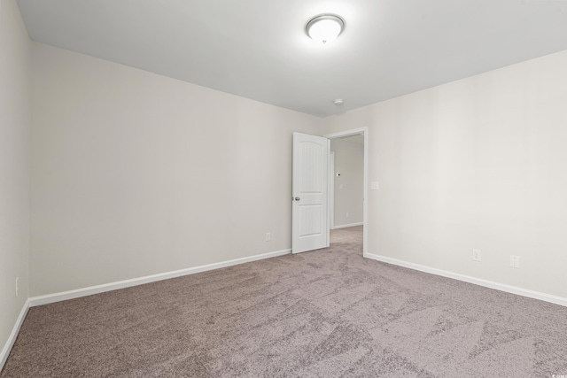 112 Lakota Loop, Longs, SC 29568 - empty room with carpet, baseboards, and a smoke detector