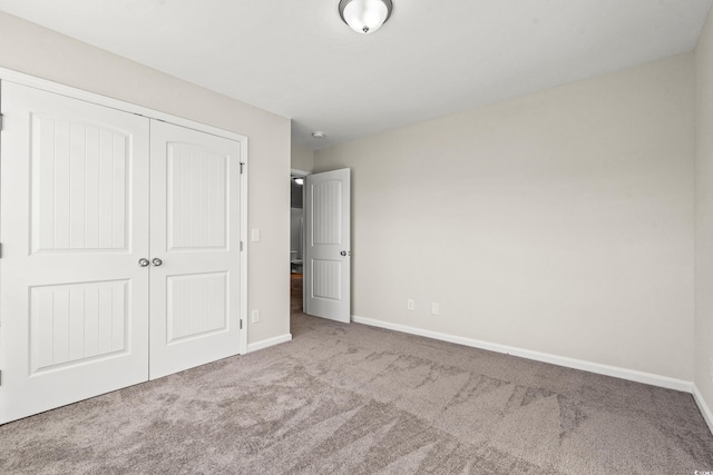 112 Lakota Loop, Longs, SC 29568 - unfurnished bedroom featuring carpet flooring, a closet, and baseboards