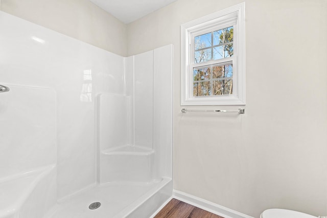 112 Lakota Loop, Longs, SC 29568 - full bathroom with baseboards, a shower, wood finished floors, and toilet