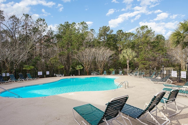 view of pool featuring a patio