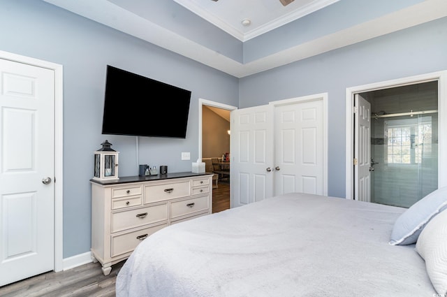 bedroom with hardwood / wood-style flooring and ornamental molding