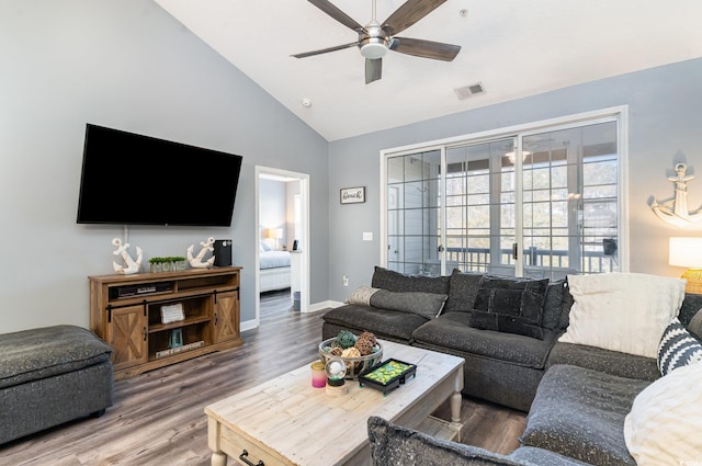 living room featuring ceiling fan, wood-type flooring, and lofted ceiling