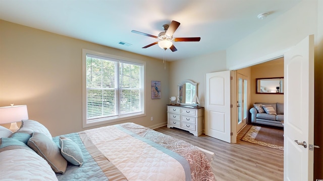 bedroom featuring ceiling fan and light wood-type flooring