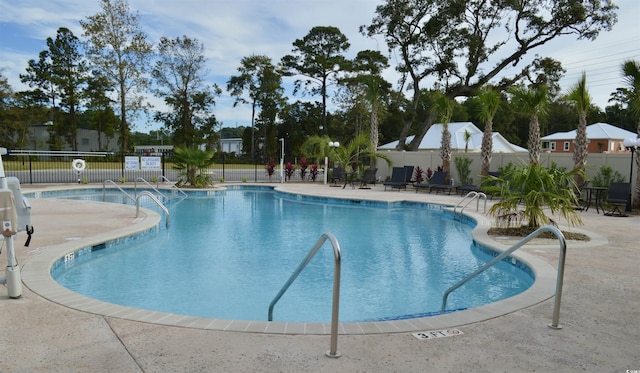 view of swimming pool featuring a patio area