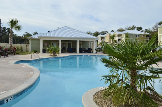 view of pool featuring a patio