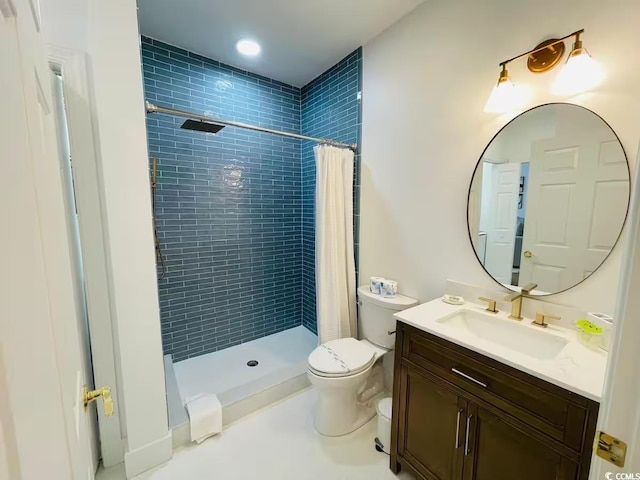 bathroom with toilet, vanity, and a shower with curtain