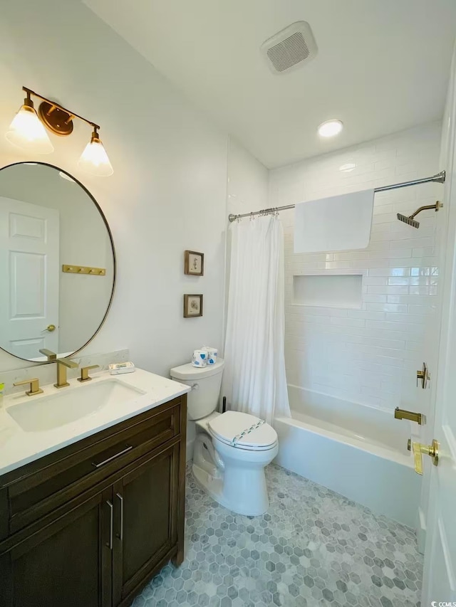 full bathroom featuring toilet, tile patterned flooring, shower / bath combo, and vanity