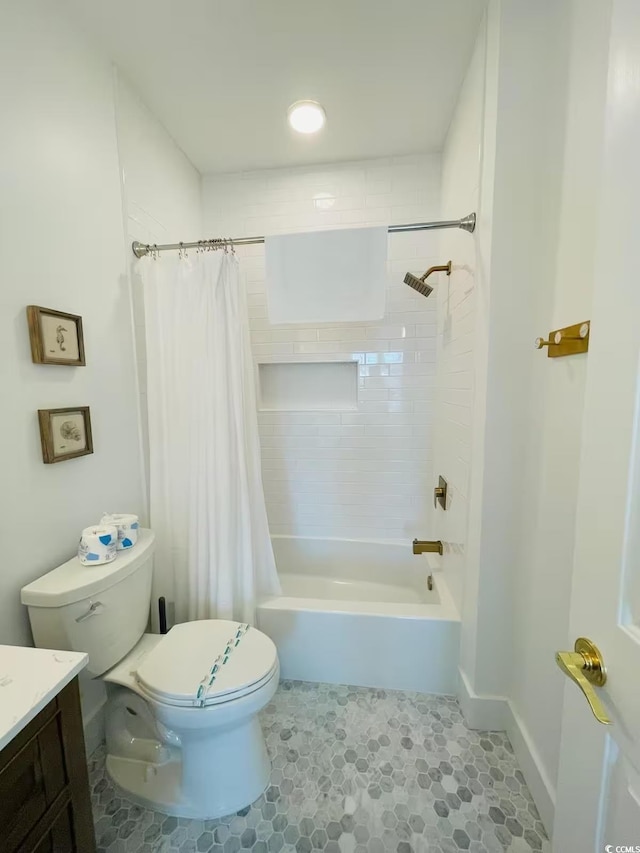 full bathroom featuring toilet, vanity, tile patterned floors, and shower / bath combo with shower curtain