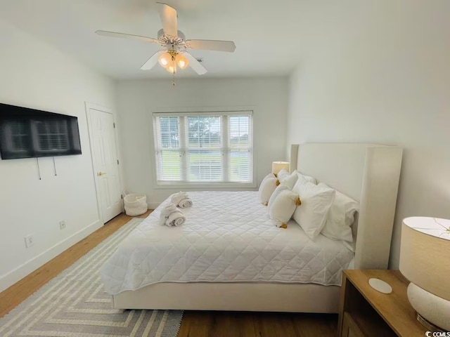 bedroom featuring ceiling fan and wood-type flooring