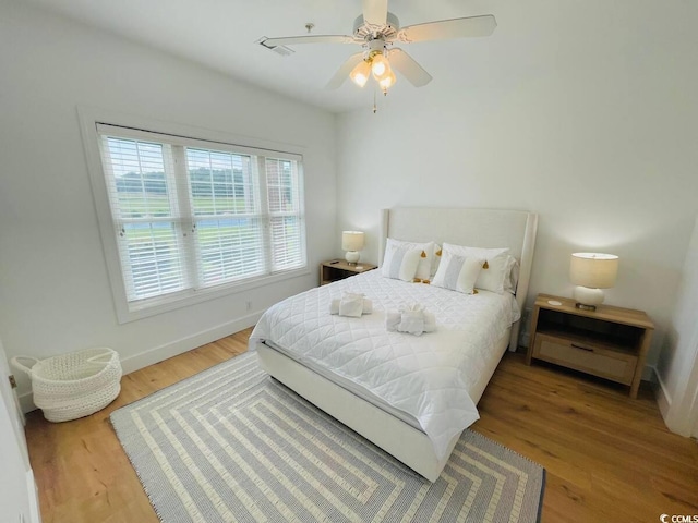 bedroom featuring ceiling fan and hardwood / wood-style floors