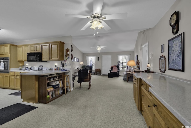 kitchen with ceiling fan, light carpet, black appliances, and lofted ceiling