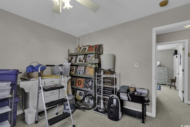 interior space with ceiling fan and carpet floors