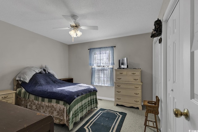 bedroom featuring a textured ceiling and ceiling fan