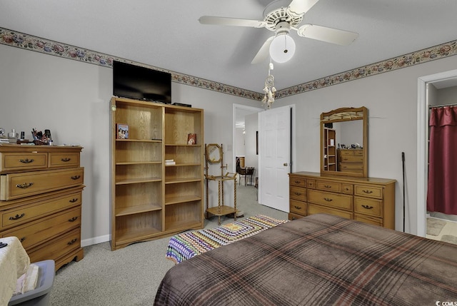 bedroom featuring ceiling fan and light carpet