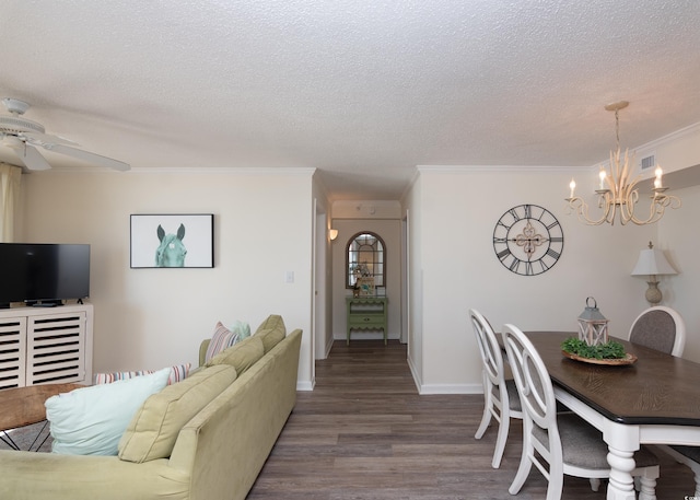 living room with hardwood / wood-style flooring, ornamental molding, and a textured ceiling