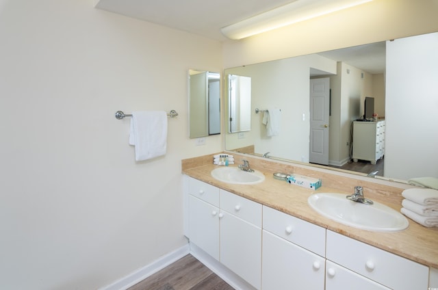 bathroom with vanity and hardwood / wood-style flooring