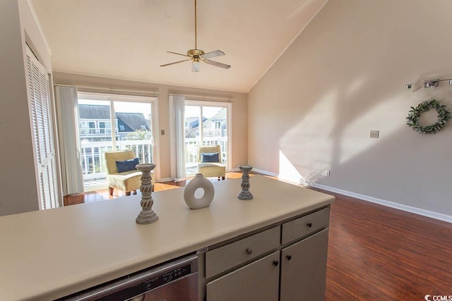 kitchen featuring dishwasher, lofted ceiling, dark hardwood / wood-style floors, and ceiling fan