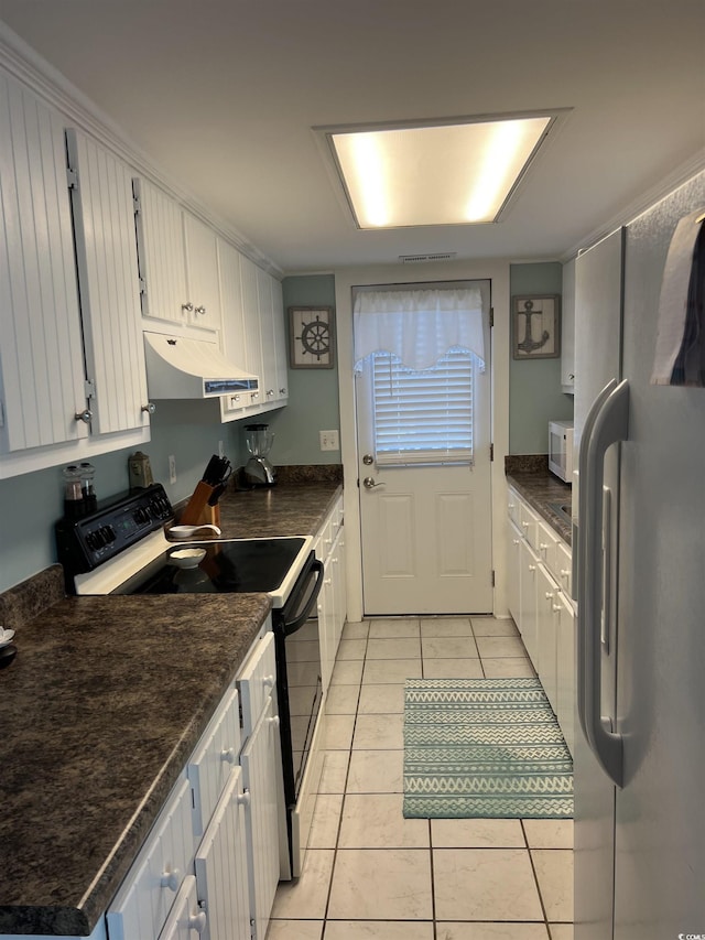 kitchen featuring white cabinetry, range with electric cooktop, light tile patterned floors, and fridge with ice dispenser