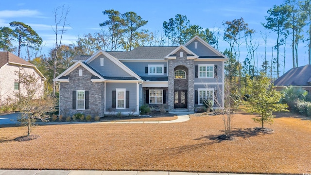 craftsman-style house with a front lawn